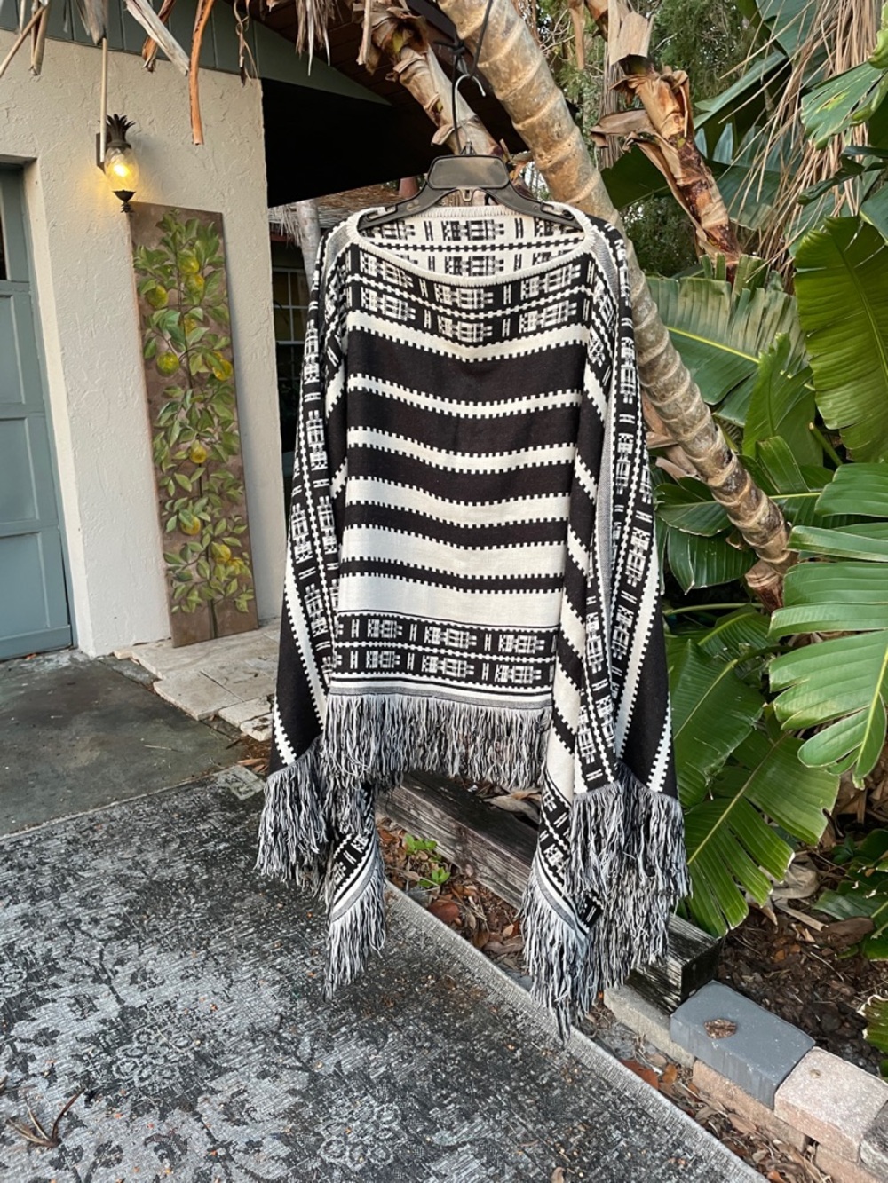 fringe bohemian, tribal style poncho, or cape